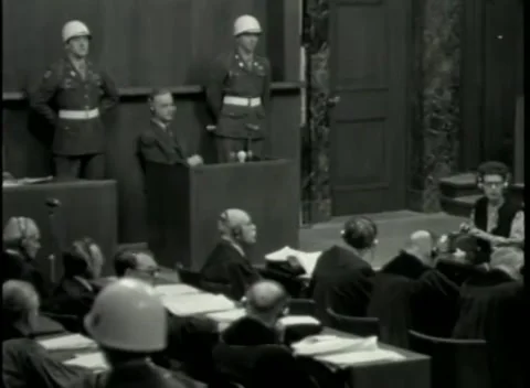 NUREMBERG - 1946: War Crimes Trials — Across the counsel benches to the box 動画素材 342920171
