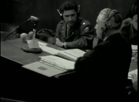 NUREMBERG - 1946: War Crimes Trials — Writing over papers at the counsel table Видео 342920185