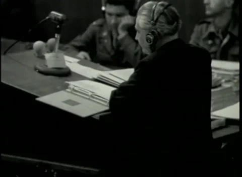 NUREMBERG - 1946: War Crimes Trials — Over the shoulder at the document table Video stock 342920208