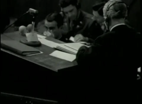 NUREMBERG - 1946: War Crimes Trials — Note-taking at the counsel table Stock Footage 342920209