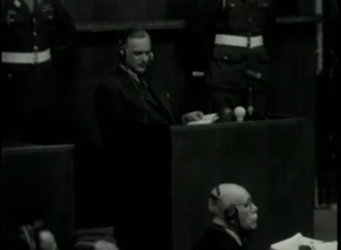 NUREMBERG - 1946: War Crimes Trials — A man in headphones at the stand 库存影片 342920213