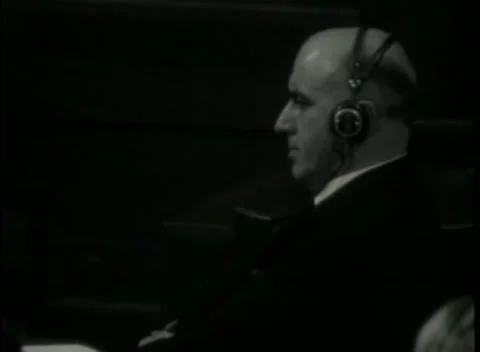 NUREMBERG - 1946: War Crimes Trials — Lit profile in translation headphones Stock Footage 342920232