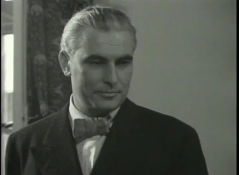 NUREMBERG - 1946: War Crimes Trials — Close on an older man in a bow tie Stock Footage 342920282