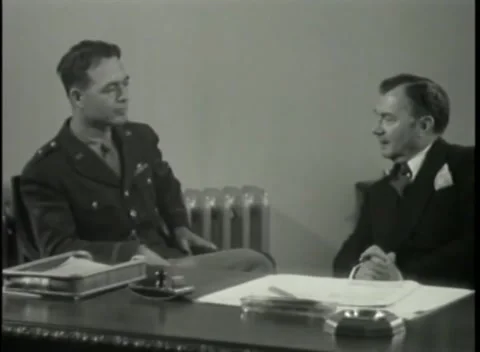 NUREMBERG - 1946: War Crimes Trials — Officer in an armchair by the desk 動画素材 342920337