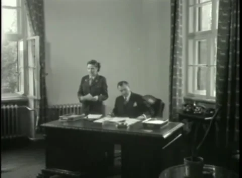 NUREMBERG - 1946: War Crimes Trials — Uniformed woman at the open window Stock Footage 342920372