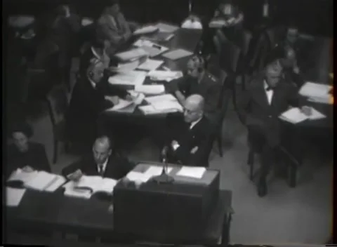 NUREMBERG - 1946: War Crimes Trials — Interpretation headsets at the counsel Stock Footage 342921171