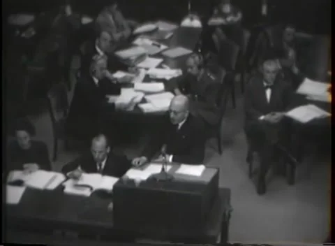 NUREMBERG - 1946: War Crimes Trials — Open ledgers on the tribunal benches Stock Footage 342921174