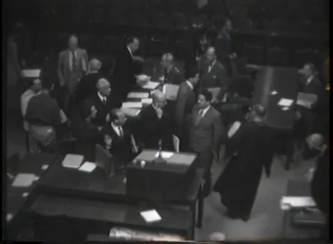 NUREMBERG - 1946: War Crimes Trials — Legal gowns gather at the front desk Stock Footage 342921201