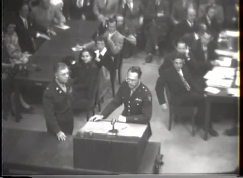 NUREMBERG - 1947: I.G. Farben case — Microphone between two officers Stock-Footage 343320901