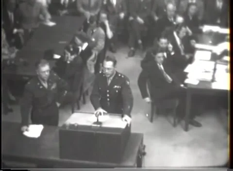 NUREMBERG - 1947: I.G. Farben case — Rear view of officer at lectern Video stock 343320906