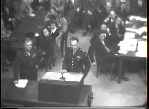 NUREMBERG - 1947: I.G. Farben case — Raised arm above court staff row 库存影片 343320907