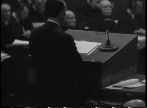 NUREMBERG, GERMANY - 1945: Composition - Speaker fills frame beside microphone Vídeo Stock 344489592