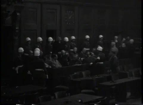 NUREMBERG, GERMANY - 1945: Security detail - Guards line a crowded two-tier dock Stock Footage 344489690