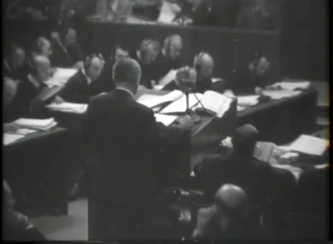 NUREMBERG, GERMANY - 1945: War Crimes Trials — Bench sorts and passes papers Stock Footage 342819073