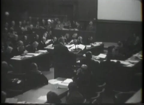 NUREMBERG, GERMANY - 1945: War Crimes Trials — Arm raised over the desk Видео 342819088