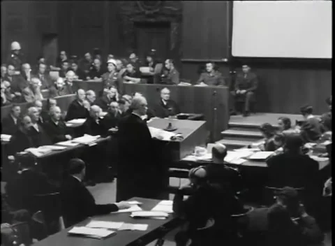 NUREMBERG, GERMANY - 1945: War Crimes Trials — A man at the gallery rail Stock Footage 342819155
