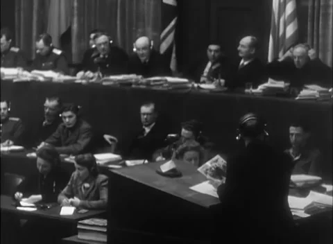 NUREMBERG, GERMANY - 1946: Allied panel - Judges examine files and bound volumes Stock Footage 344489231