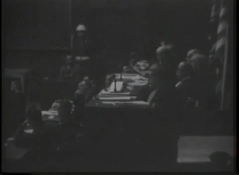 NUREMBERG, GERMANY - 1946: Central paper fold - Seated panel reviews documents Stock Footage 344901458