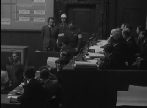 NUREMBERG, GERMANY - 1946: Document bench - Standing man scans the chamber Stock Footage 344491167