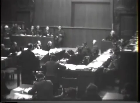 NUREMBERG, GERMANY - 1946: Empty wall - Occupied tables line the courtroom floor Stock Footage 344902041