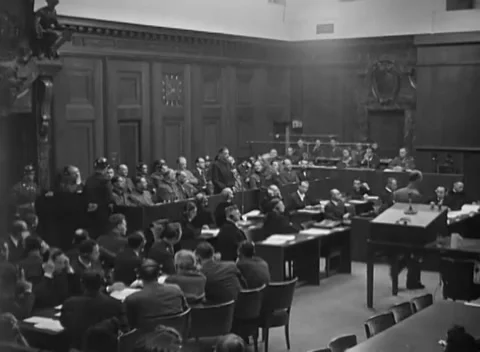 NUREMBERG, GERMANY - 1946: Gesture - Desk worker raises finger toward dock Stock Footage 344490180