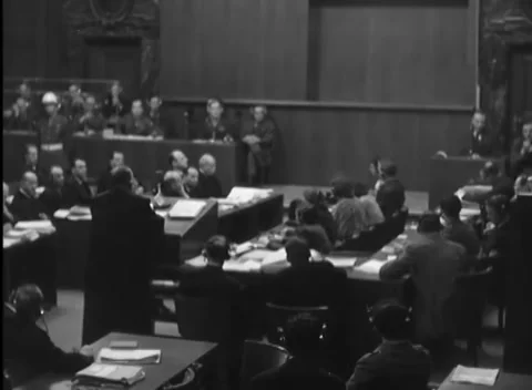 NUREMBERG, GERMANY - 1946: Headset rows - Clerks write beneath guarded gallery 스톡 동영상 344489267
