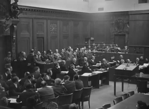 NUREMBERG, GERMANY - 1946: Headset rows - Guard watches man leaning from dock Stock Footage 344490215