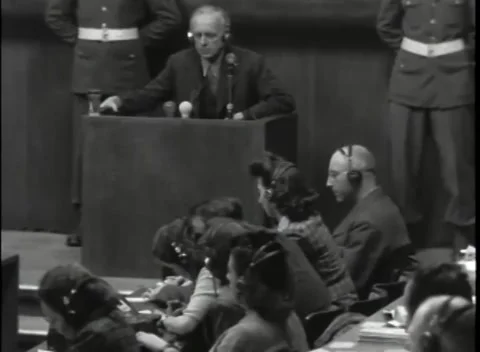 NUREMBERG, GERMANY - 1946: Headset testimony - Witness at clustered microphones Stock Footage 343848139