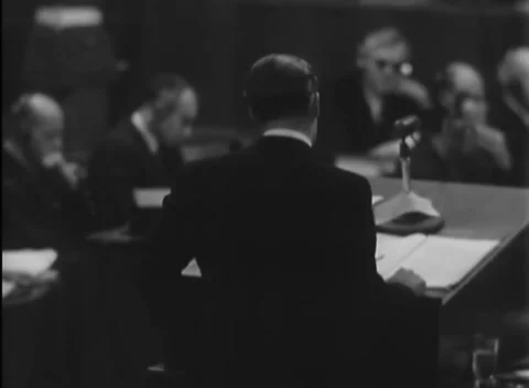 NUREMBERG, GERMANY - 1946: Lower angle - Documents cover sloped lectern Stock Footage 344489395