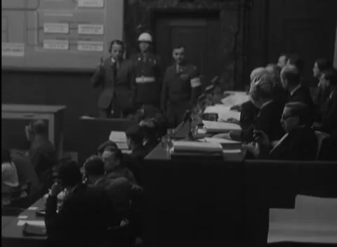 NUREMBERG, GERMANY - 1946: Oath gesture - Witness holds up his right hand Stock-Footage 344491165