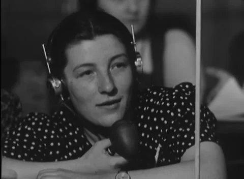 NUREMBERG, GERMANY - 1946: Pale document - Interpreter gives a small smile Stock Footage 344490415