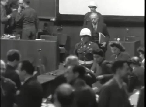 NUREMBERG, GERMANY - 1946: Platform departure - Escort crosses crowded floor Stock Footage 343848152