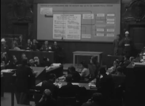 NUREMBERG, GERMANY - 1946: Reverse gallery - Women work among courtroom staff Stock-Footage 344491136