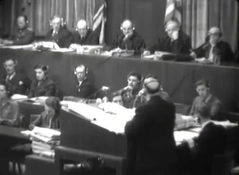 NUREMBERG, GERMANY - 1946: Right-edge figure - Legal bundles stack by panel Stock Footage 344901673