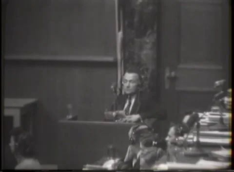 NUREMBERG, GERMANY - 1946: Right-side desk row - Audience frames testimony Stock Footage 344901734