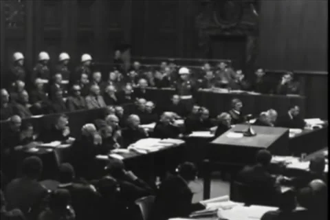 NUREMBERG, GERMANY - 1946: Security detail - Four guards line crowded dock Stock Footage 344489492