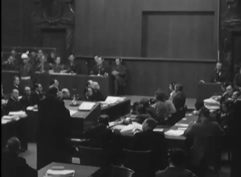 NUREMBERG, GERMANY - 1946: Static view - Case files crowd courtroom work rows Stock Footage 344489287