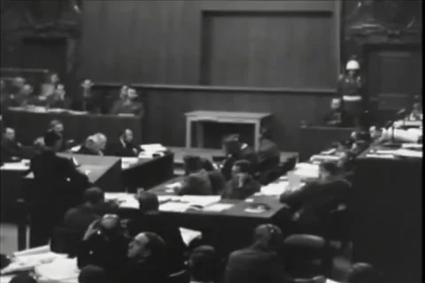 NUREMBERG, GERMANY - 1946: Tribunal layout - Central lectern splits busy floor Video stock 344489489