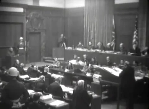 NUREMBERG, GERMANY - 1946: Tripod camera - Personnel work at tiered desks Stock Footage 344901721