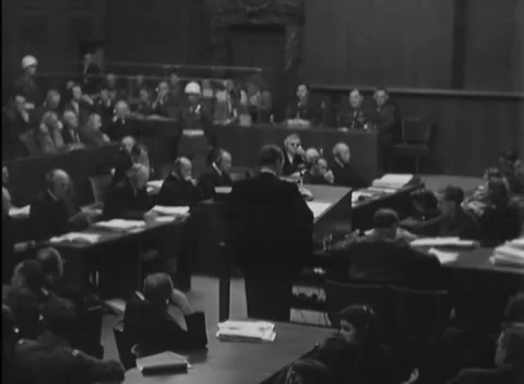 NUREMBERG, GERMANY - 1946: Two-guard gallery - Woman clerk listens in court Stock Footage 344489398