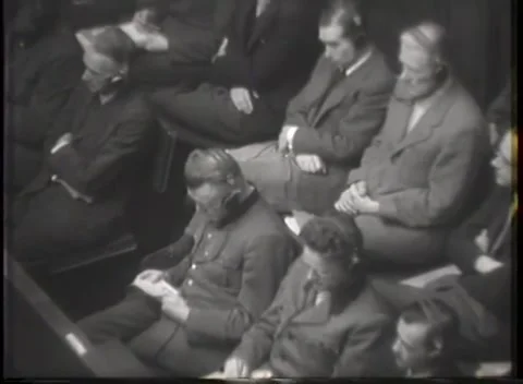 NUREMBERG, GERMANY - 1946: War Crimes Trials — Close groups along the dock rail Stockbeeldmateriaal 342670698
