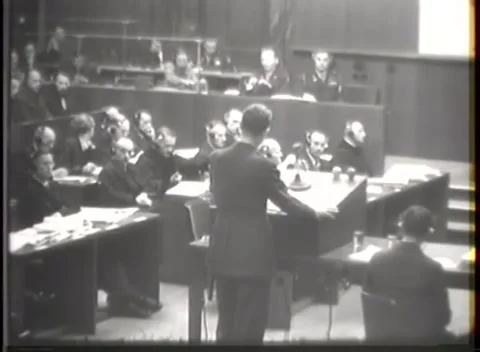 NUREMBERG, GERMANY - 1946: War Crimes Trials — Arms spread wide at the desk Видео 342670720