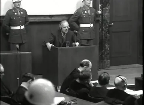 NUREMBERG, GERMANY - 1946: War Crimes Trials — Witness box under Army guard Stockbeeldmateriaal 342670752