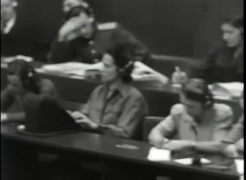 NUREMBERG, GERMANY - 1946: War Crimes Trials — Court staff writing at the desks Видео 342670802