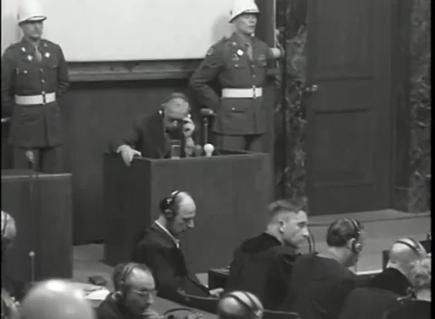 NUREMBERG, GERMANY - 1946: War Crimes Trials — Two guards posted at the box Stock Footage 342670833