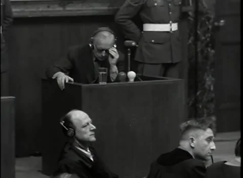 NUREMBERG, GERMANY - 1946: War Crimes Trials — Close on the man in headphones Stockbeeldmateriaal 342670835