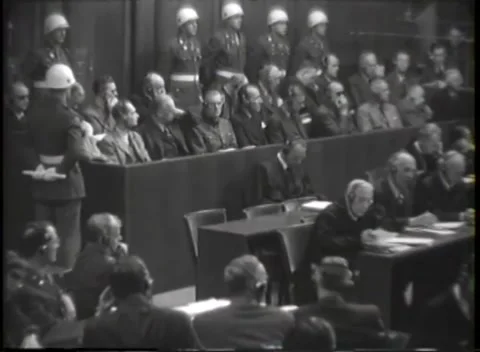 NUREMBERG, GERMANY - 1946: War Crimes Trials — Dock's two rows under guard Stock Footage 342818612