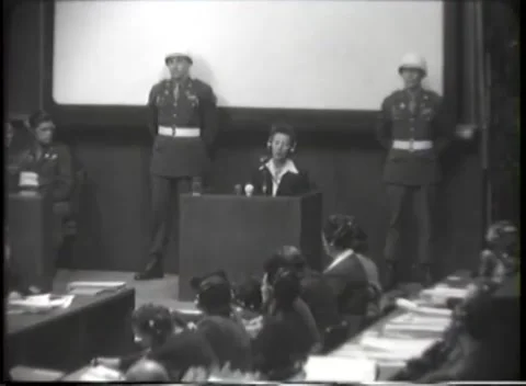 NUREMBERG, GERMANY - 1946: War Crimes Trials — Three soldiers ring the box Stock-Footage 342818621
