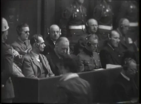 NUREMBERG, GERMANY - 1946: War Crimes Trials — Dock front row in headphones Stockbeeldmateriaal 342818628