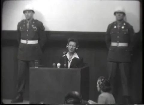NUREMBERG, GERMANY - 1946: War Crimes Trials — Woman at the box, white collar Stock Footage 342818637